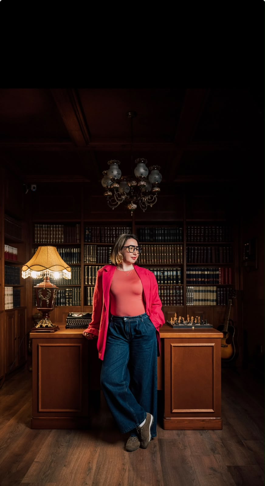 Alina Iancu standing confidently in a library, wearing visible white socks